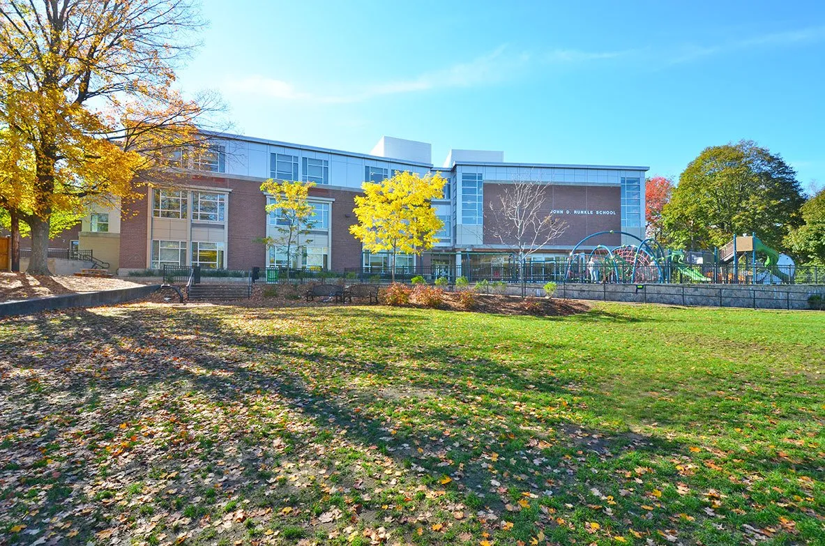The Runkle School building and playground on a sunny fall day
